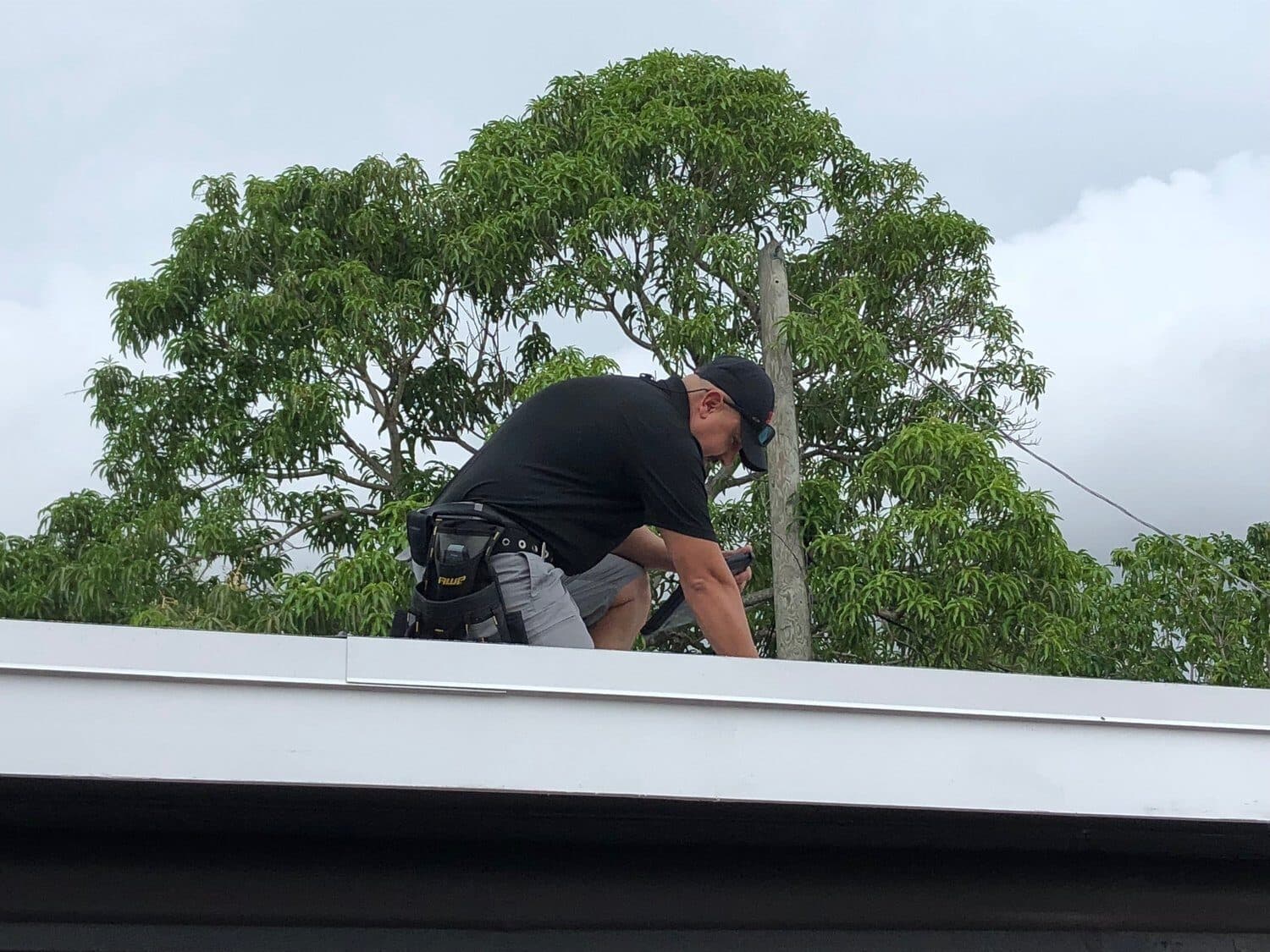 Eric Angerstein inspecting a South Florida roof